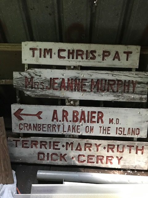 photo of old signs with names of family members.  Also says "Cranberry Lake on the Island"