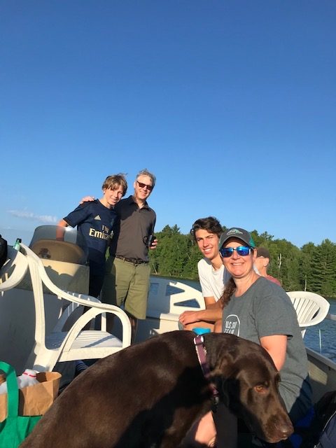 Photo of the family on the barge leaving the island.