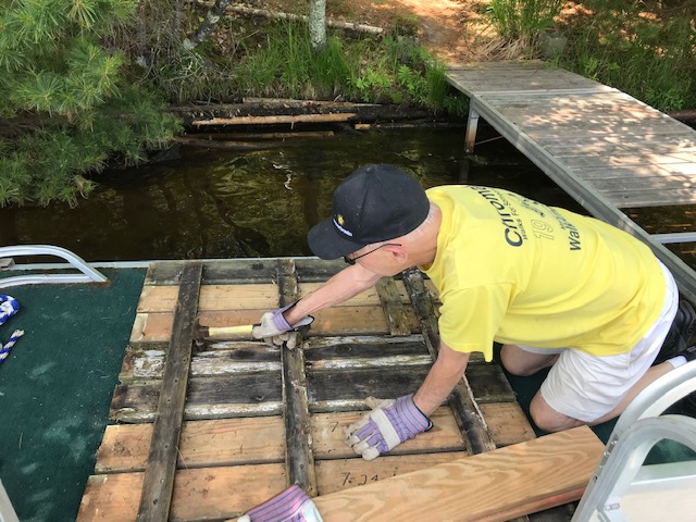 man working on pier boards