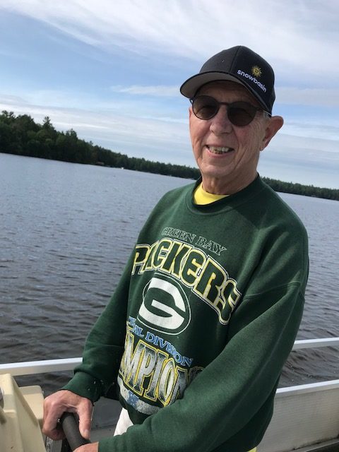 photo of man with Green Bay Packers sweatshirt