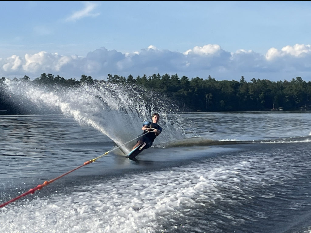 photo of Andrew water skiing with a spray tail fin