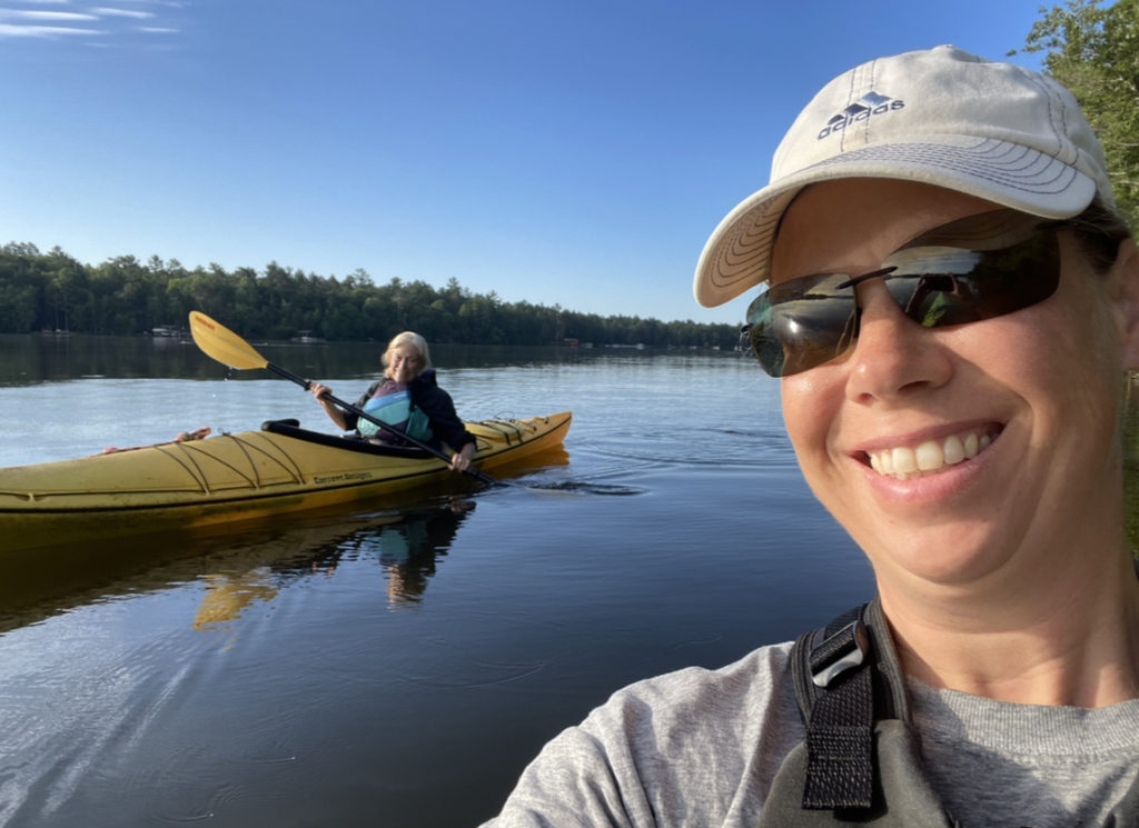 selfie photo of Laura and Ter in kayaks