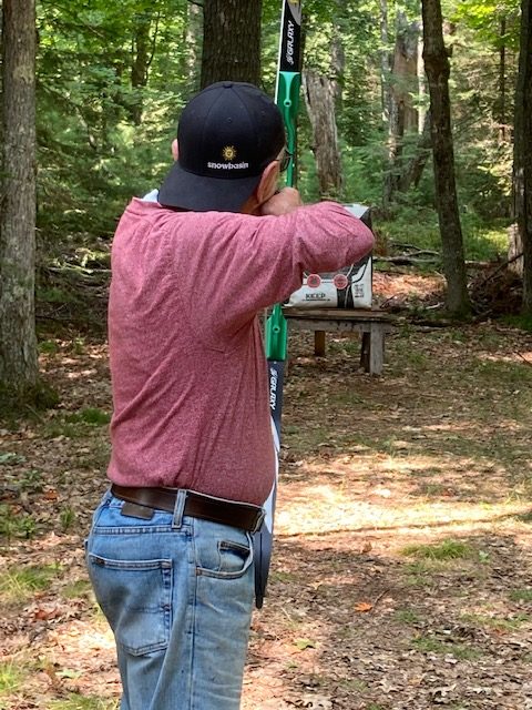 photo of man practicing archery