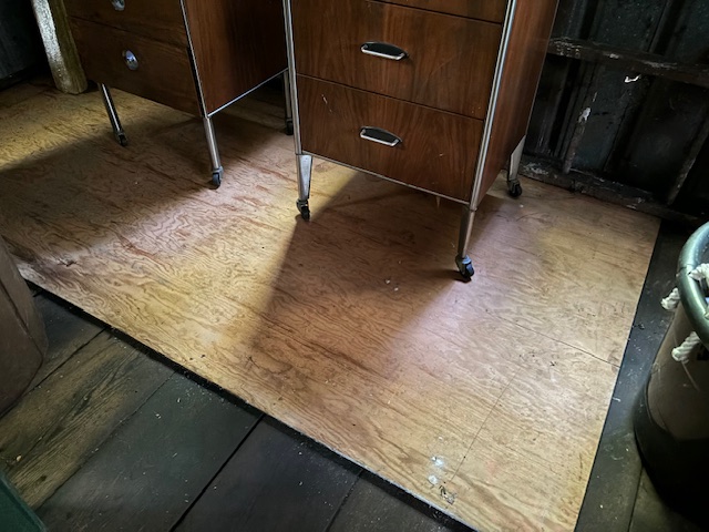 photo of old cabinet on new garage floor