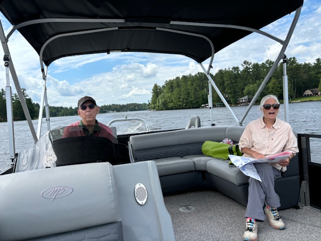 man and woman on pontoon boat