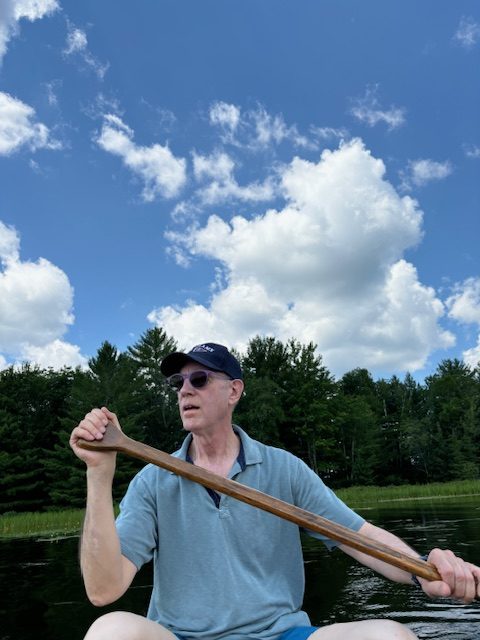 man in canoe