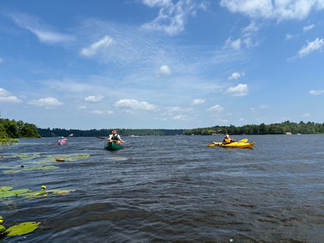 photo of yellow kayak and canoe on lake.