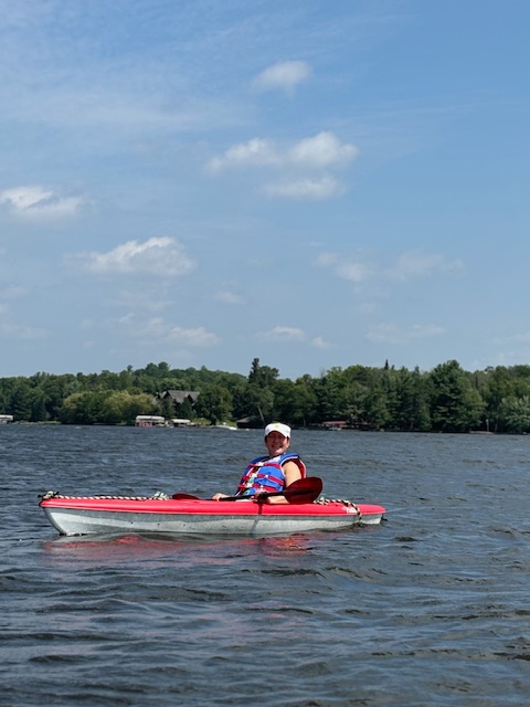 woman in red kayak