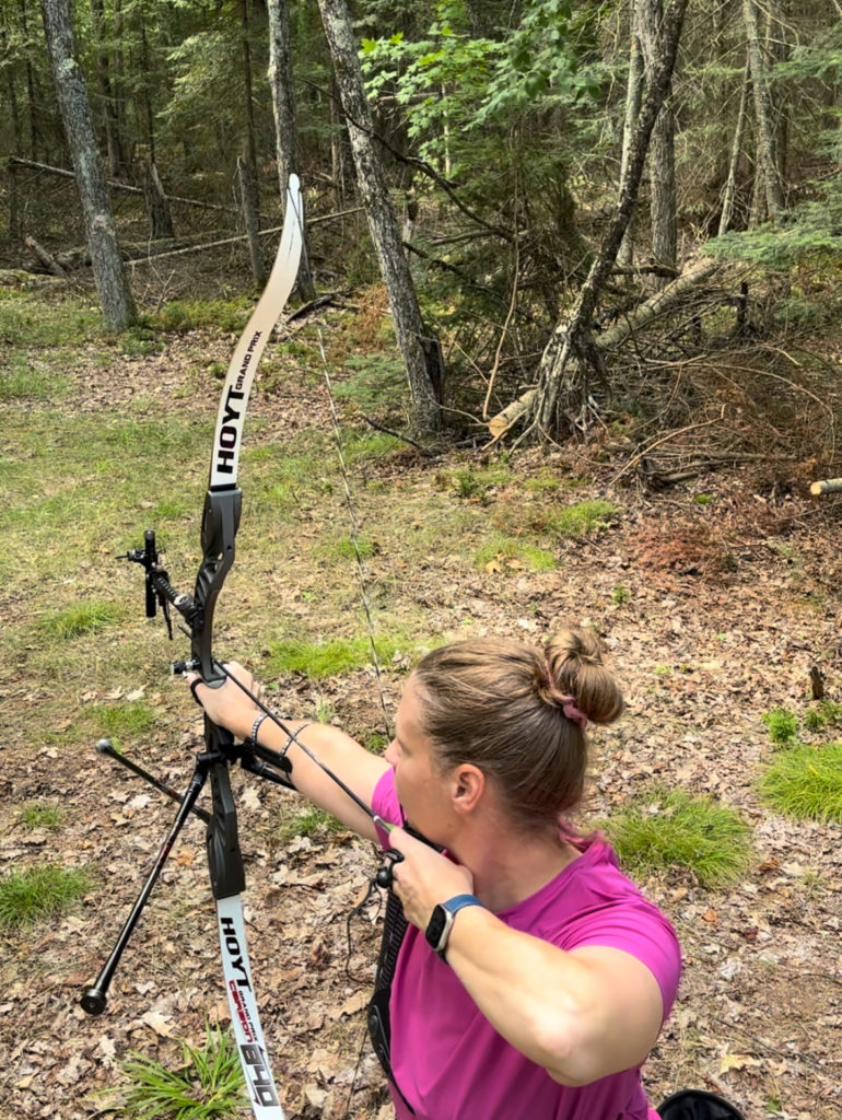 woman shooting archery