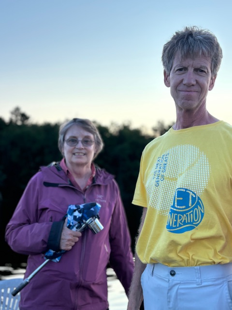 man and woman standing on lake doc