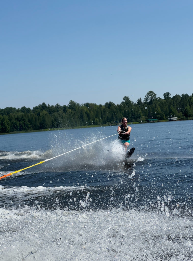 female waterskiing on lake