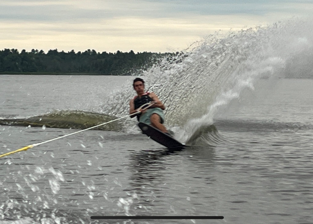 young man waterskiing