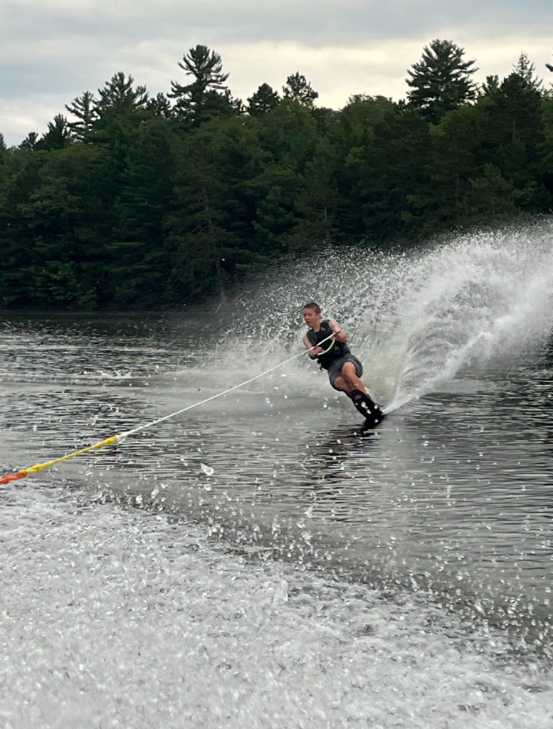 boy waterskiing