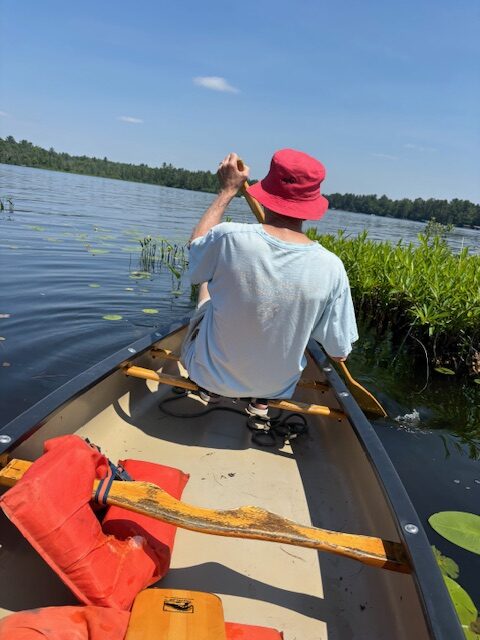man in canoe